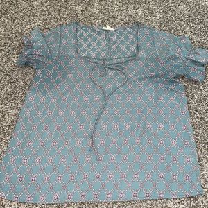 Top with ruffle sleeves